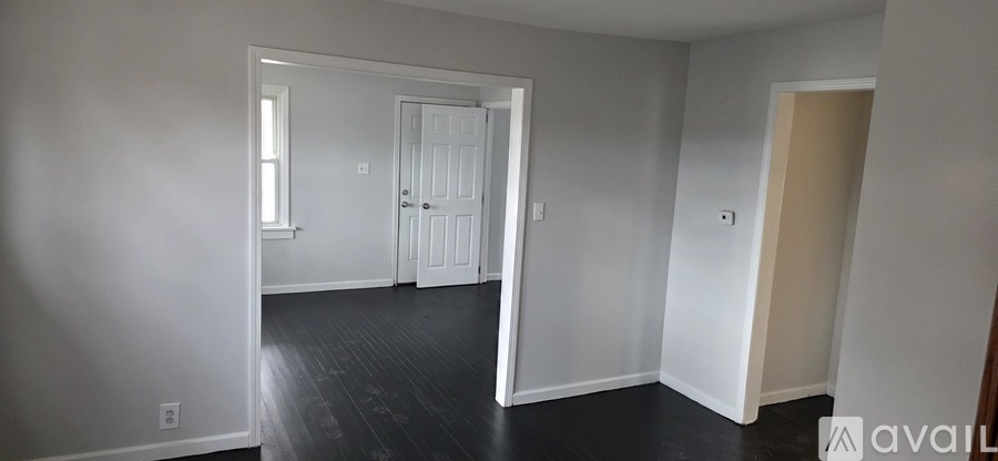 A room with a door and a window.