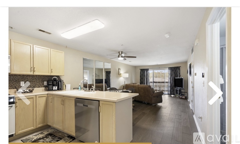 A kitchen with wooden cabinets and a white countertop.