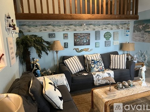 A living room with two couches and a coffee table.
