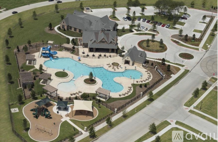 A large house with a pool and a water slide.