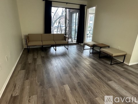A living room with a couch and a bench.