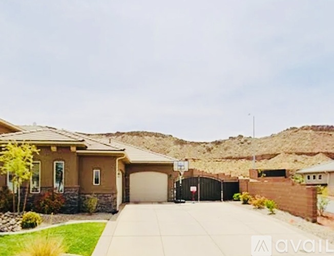 A house with a brown exterior is available for sale.