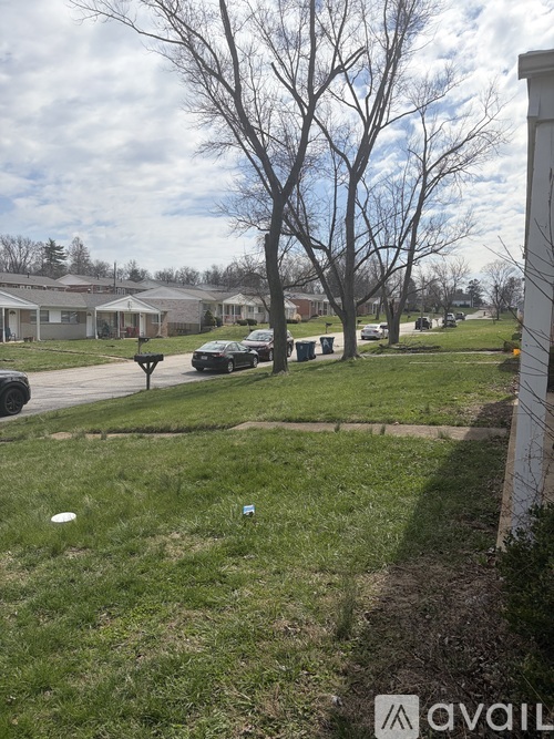 A grassy area with a sign that says "available" in the foreground.