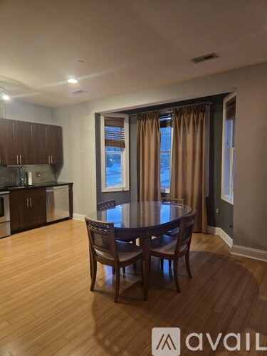 A dining room with a table and chairs is shown.
