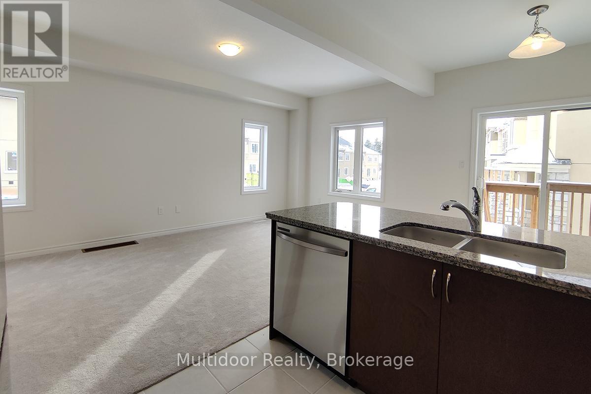 A kitchen with a sink and a window.