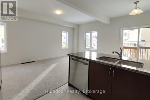 A kitchen with a sink and a window.