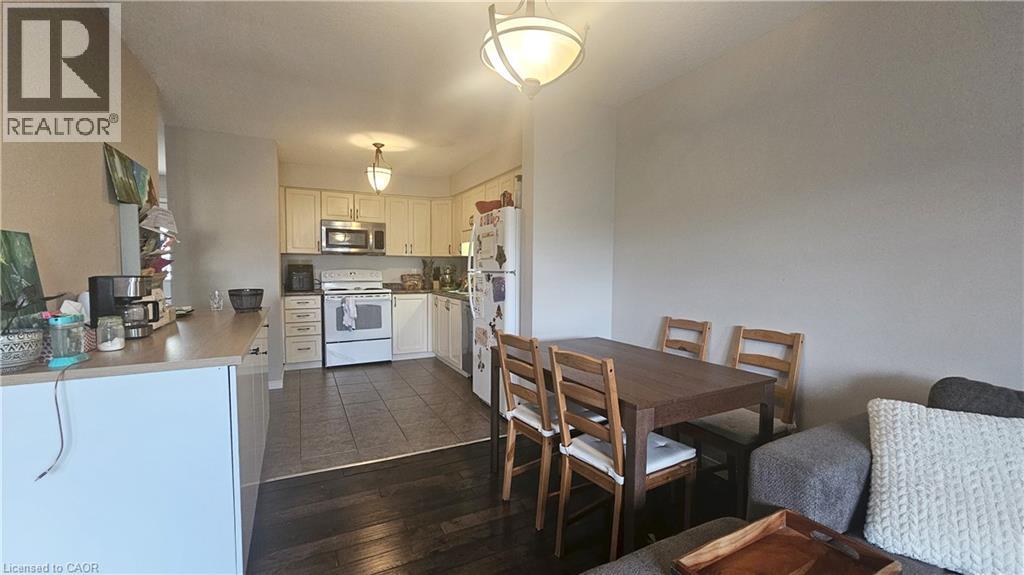 A kitchen with a dining table and chairs.