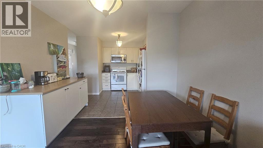 A kitchen with a table and chairs in the middle of the room.