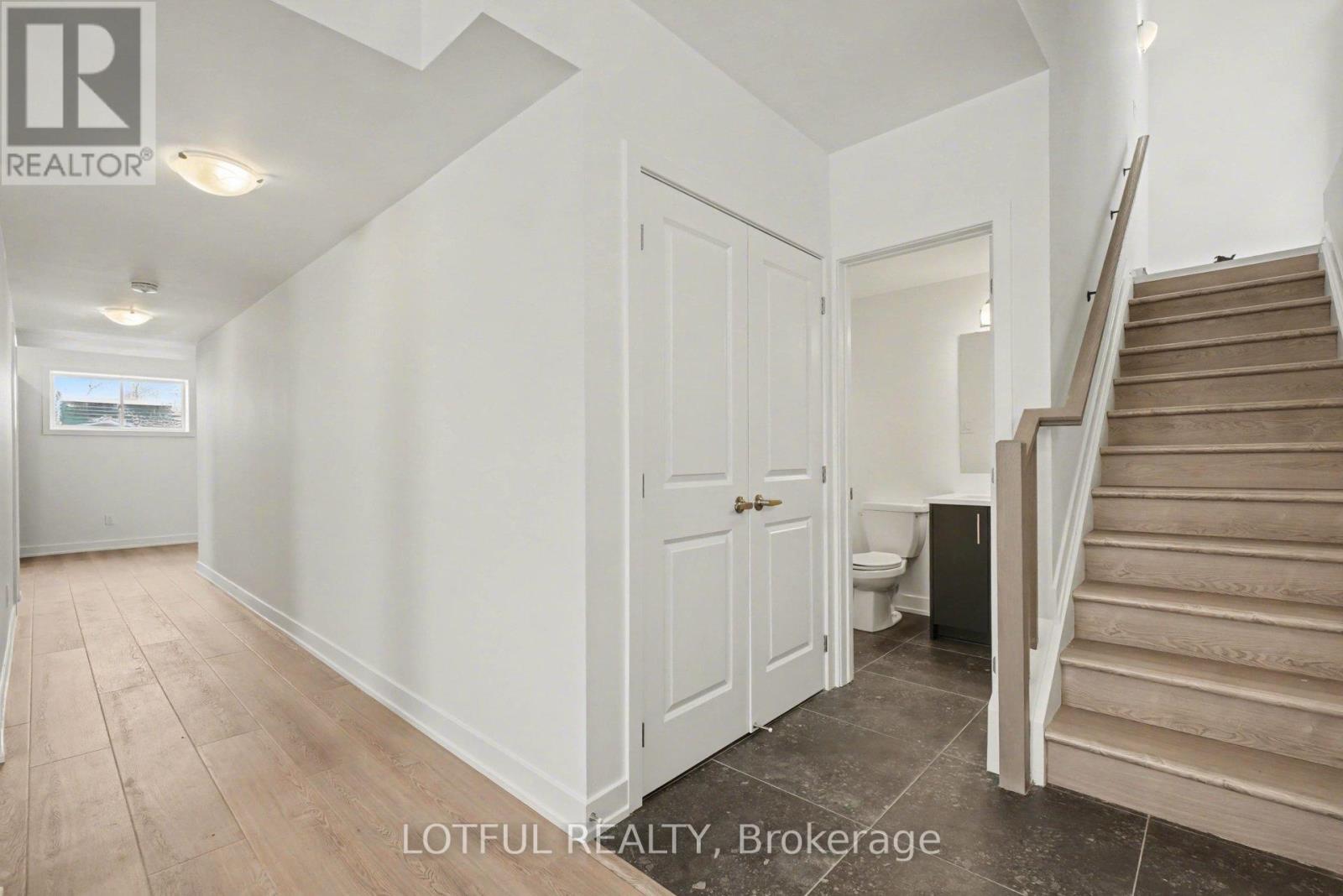A room with a staircase leading to the upper floor.