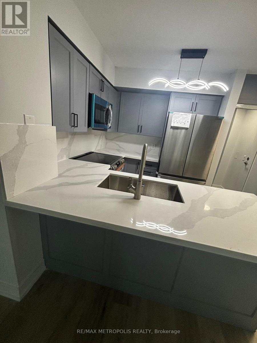 A modern kitchen with a sink and cabinets.