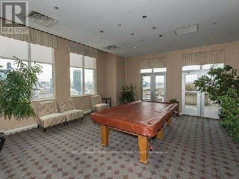 A large room with a brown table and a sofa.