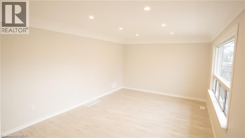 A spacious room with a window on the right side.