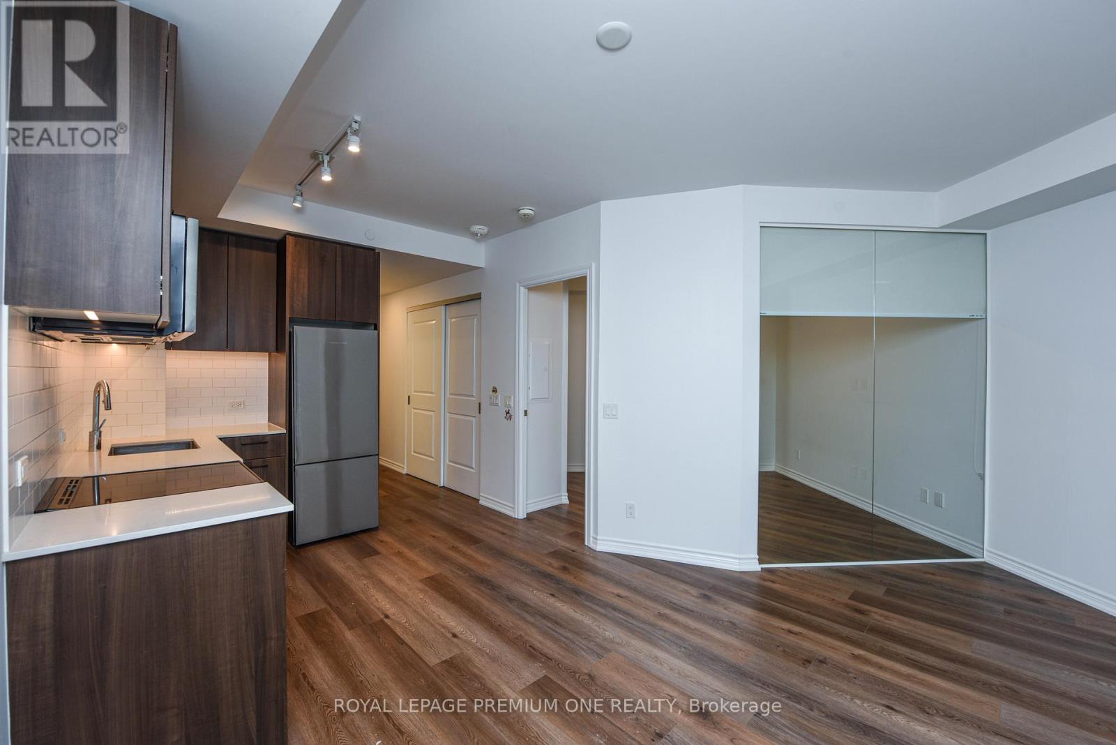 A modern kitchen with a dining table and chairs.