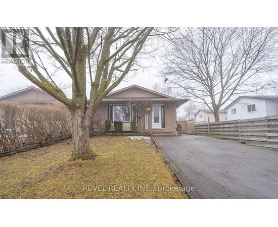 A house with a tree in front of it is for sale.