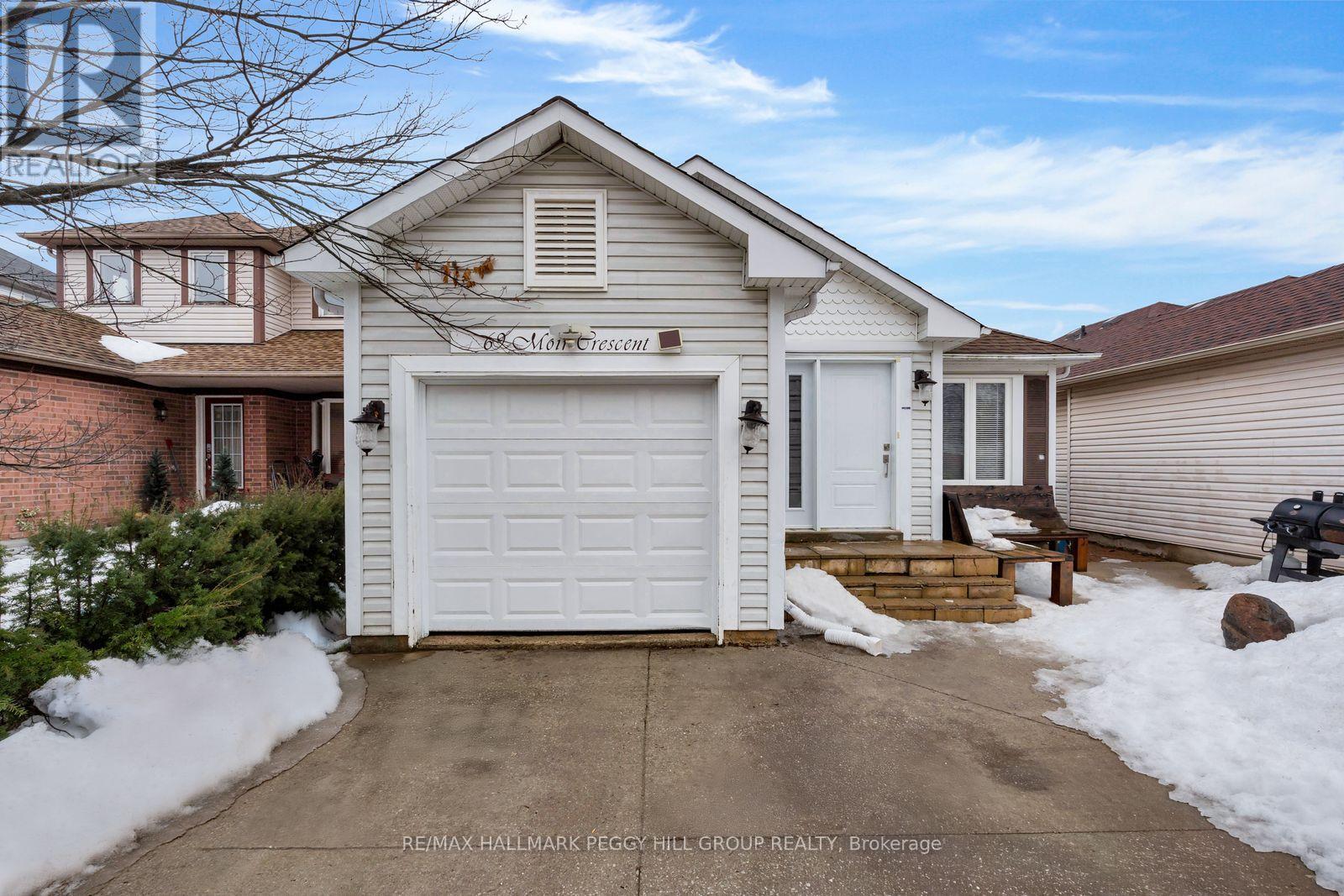 A house with a white garage door is for sale.