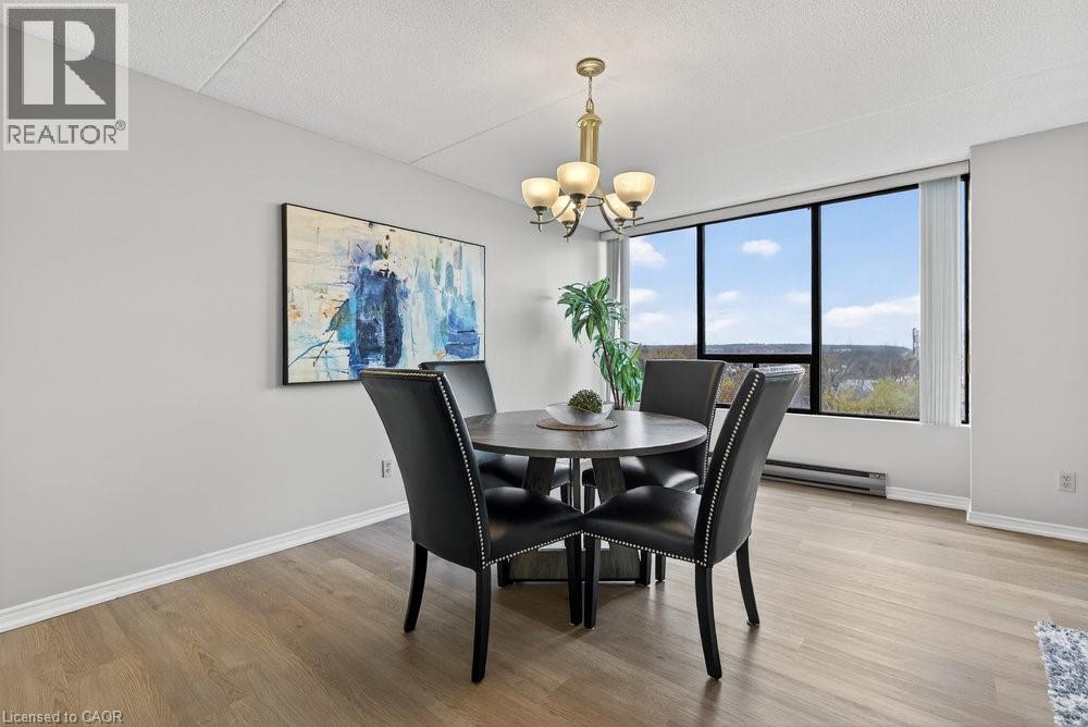 A dining room with a table set for four.