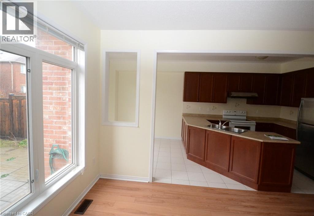 A kitchen area with a counter and a window.