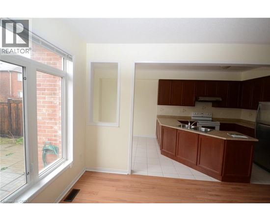 A kitchen area with a counter and a window.
