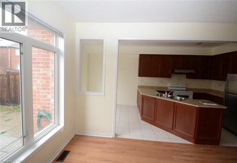 A kitchen area with a counter and a window.