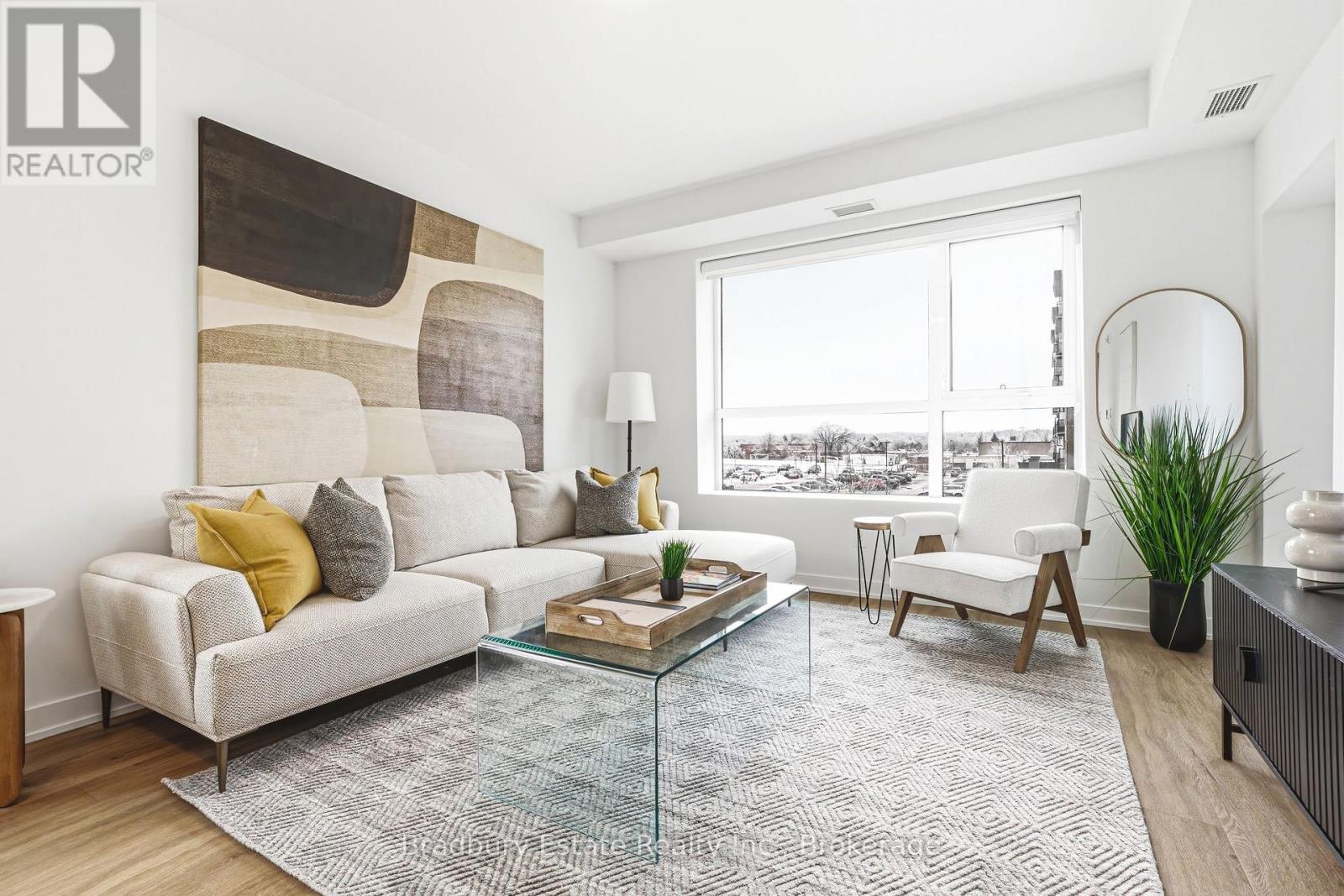 A living room with a large couch and a coffee table.