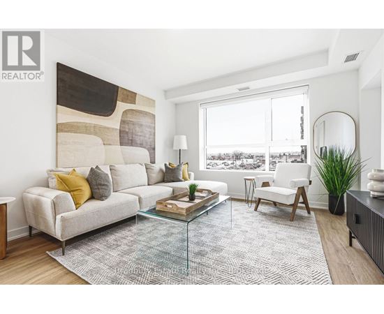 A living room with a large couch and a coffee table.