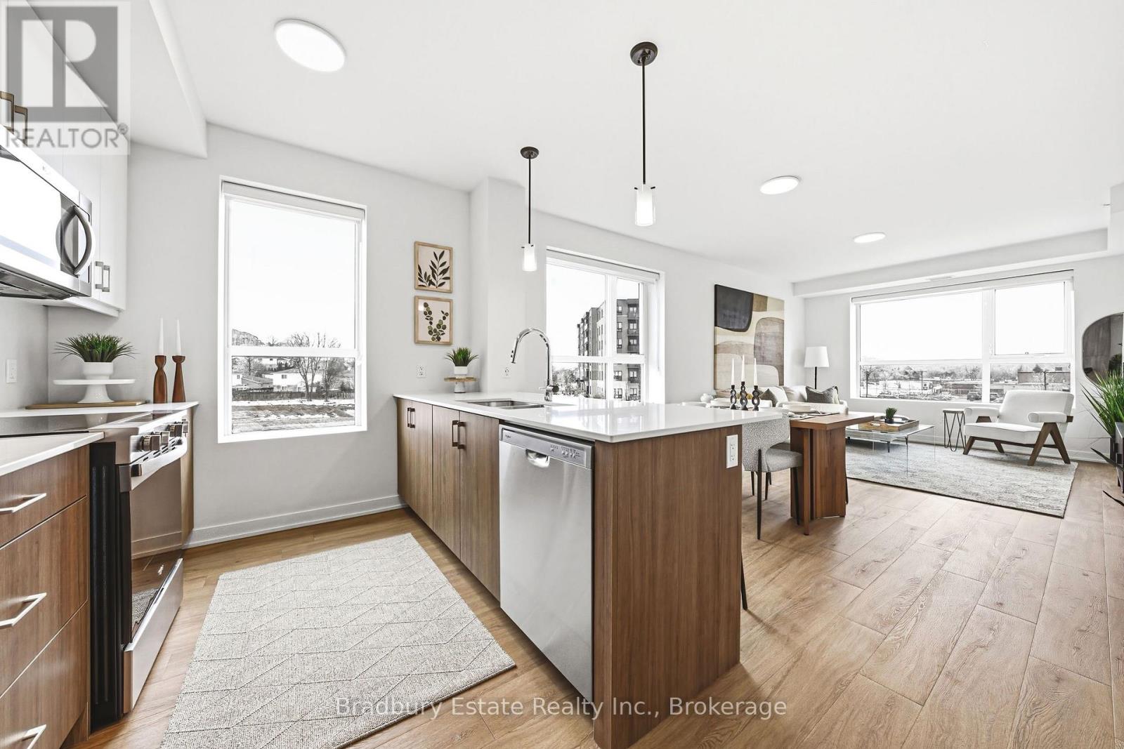 A modern kitchen with wooden cabinets and a large island.