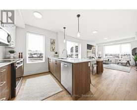 A modern kitchen with wooden cabinets and a large island.