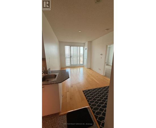 A kitchen with a sink and a window.