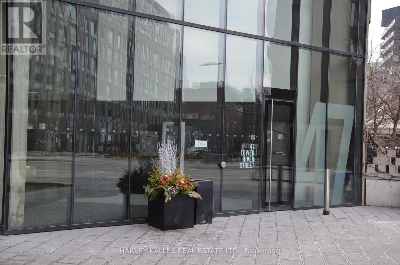 The entrance to a building with glass doors and a sign that says "Lower Street".