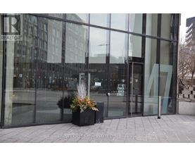 The entrance to a building with glass doors and a sign that says "Lower Street".