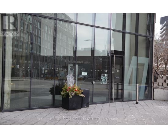The entrance to a building with glass doors and a sign that says "Lower Street".