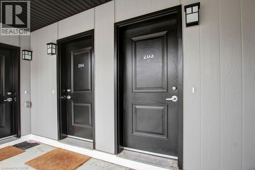 Three doors with numbers 204, 203 and 205 on them.