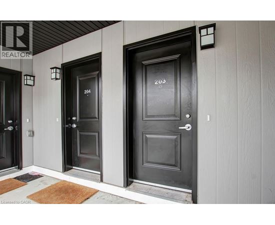 Three doors with numbers 204, 203 and 205 on them.