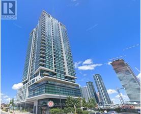 A tall building with a glass facade is the main focus of the image.
