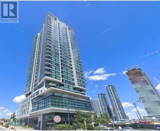 A tall building with a glass facade is the main focus of the image.