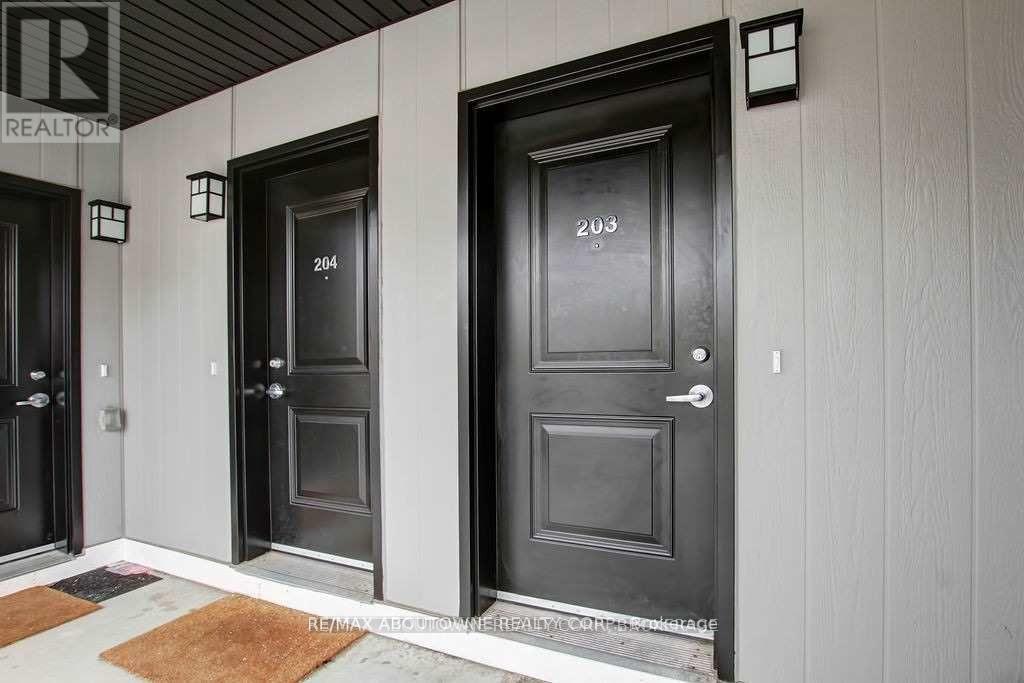 A row of doors with numbers 204 and 203 on them.