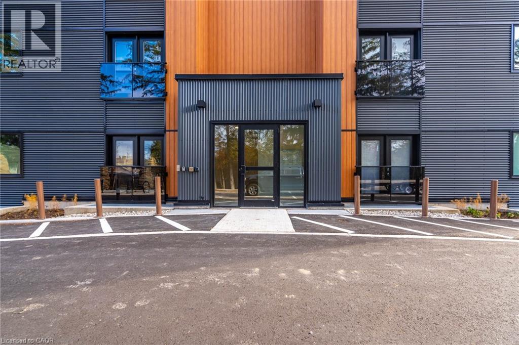 A modern building with a large entrance and a sign that reads "REALTOR".