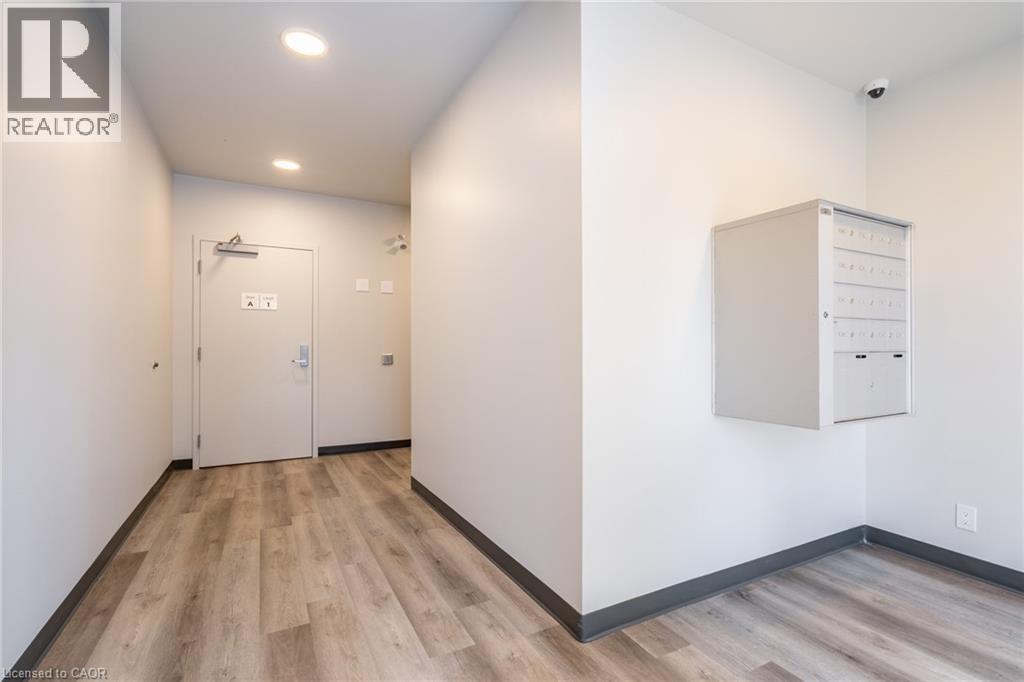 A room with a white door and a filing cabinet.