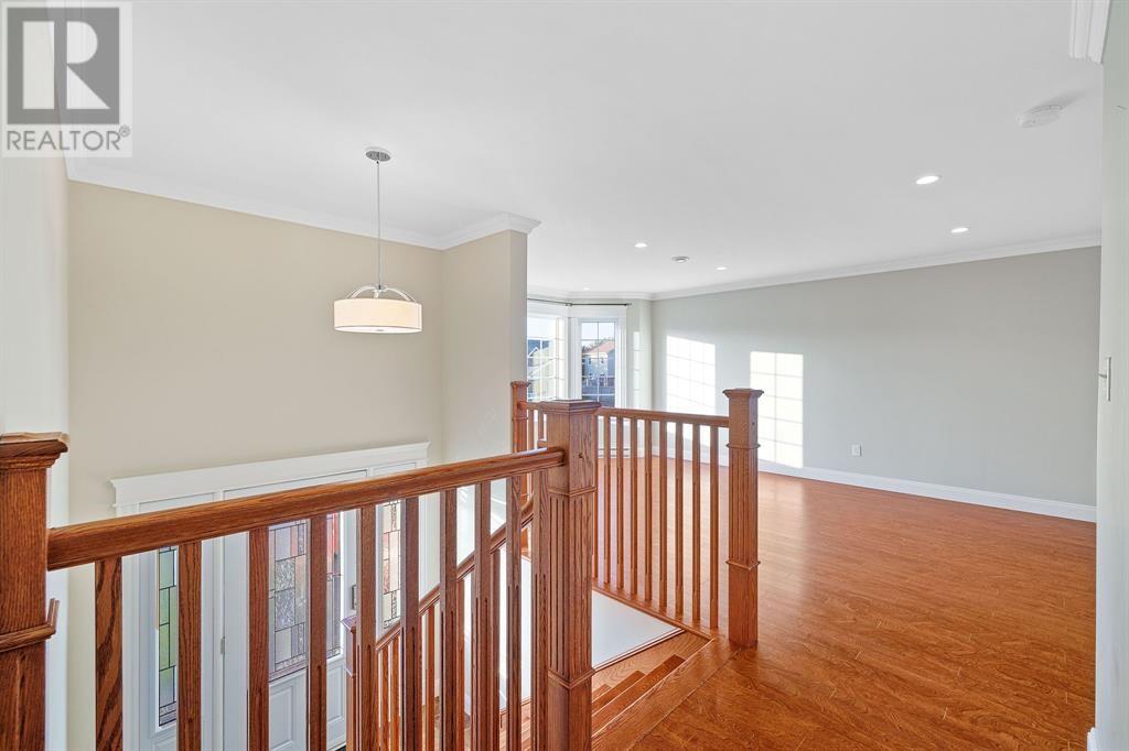 A large open space with wood floors and a white ceiling.