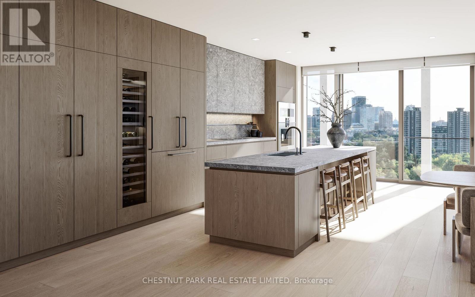 A modern kitchen with wooden cabinets and a marble countertop.