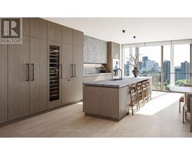 A modern kitchen with wooden cabinets and a marble countertop.