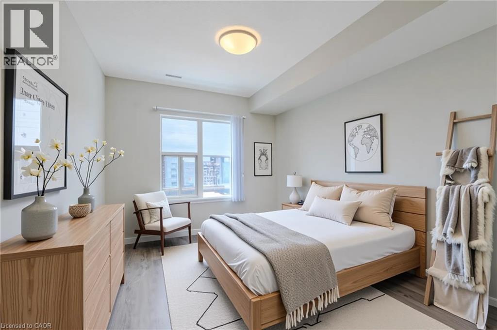 A bedroom with a large bed and a chair.