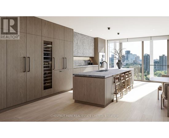 A modern kitchen with wooden cabinets and a marble countertop.