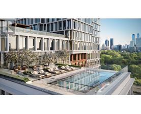 A modern building with a pool and lounge area in the foreground.