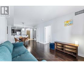 A bedroom with a bed, desk, and chair.