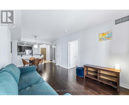 A bedroom with a bed, desk, and chair.
