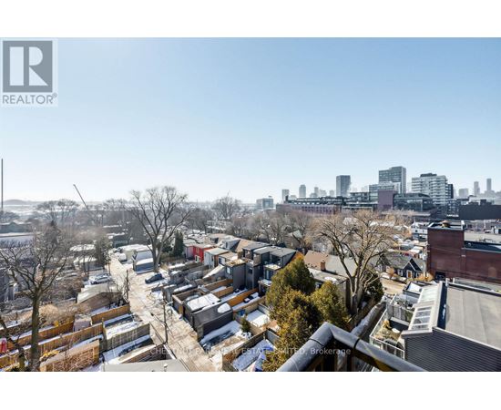 A cityscape with buildings and a clear sky.
