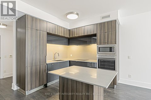 A modern kitchen with a large island in the middle.