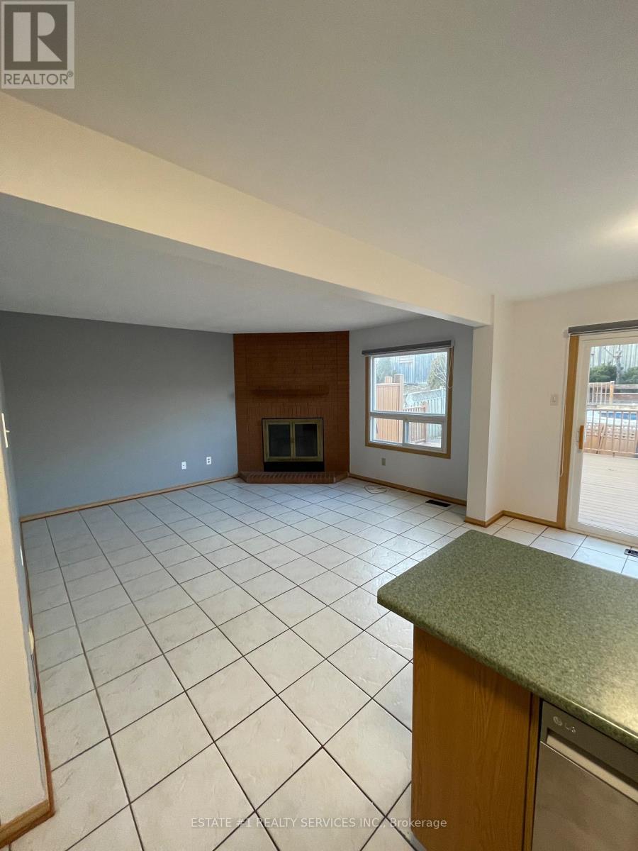 A kitchen with a green counter top and a tiled floor.