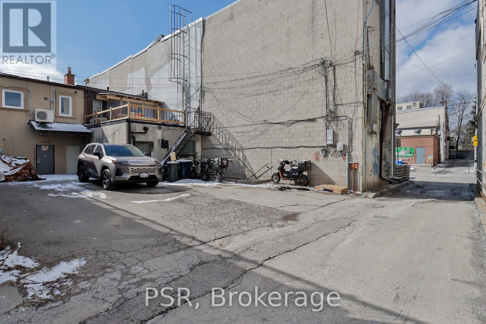 A car is parked in front of a building with the text "PSR, Brokerage" on the image.